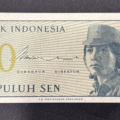 Винтидж банкнота 10 Sen 1964 от Bank Indonesia, Sepuluh Sen, ретро колекционерски дизайн с образ на жена-доброволец.