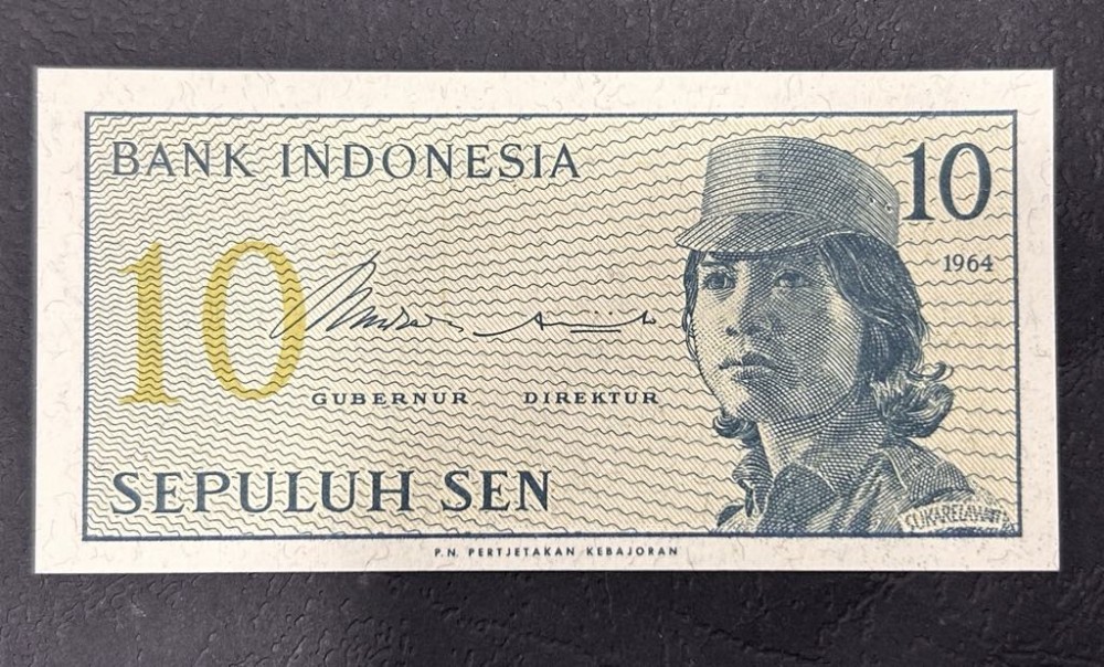 Винтидж банкнота 10 Sen 1964 от Bank Indonesia, Sepuluh Sen, ретро колекционерски дизайн с образ на жена-доброволец.